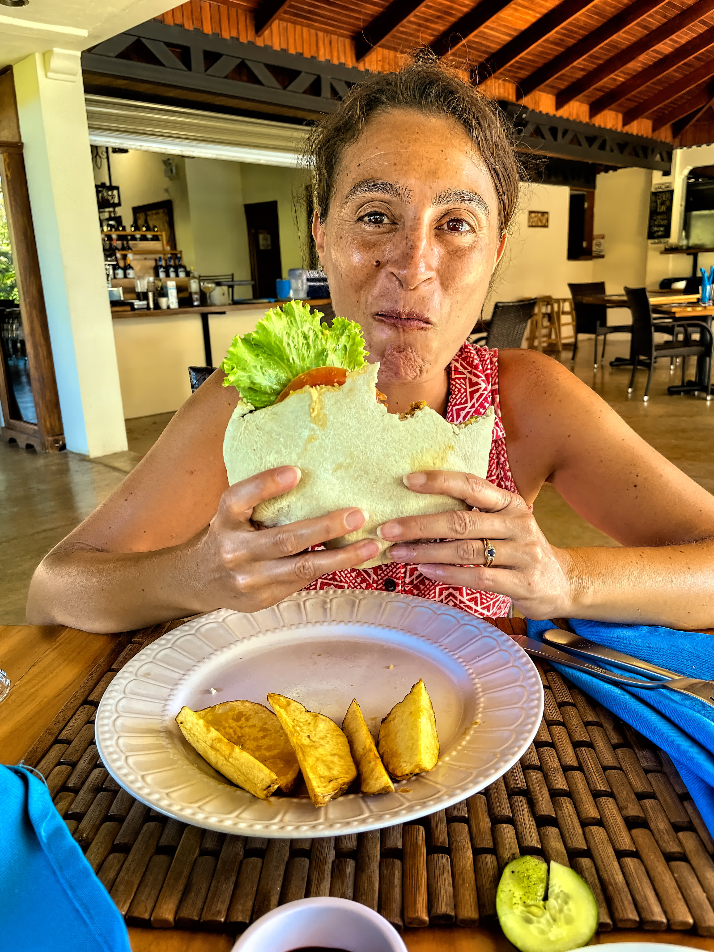 Maria enjoying a huge falafel sandwich
