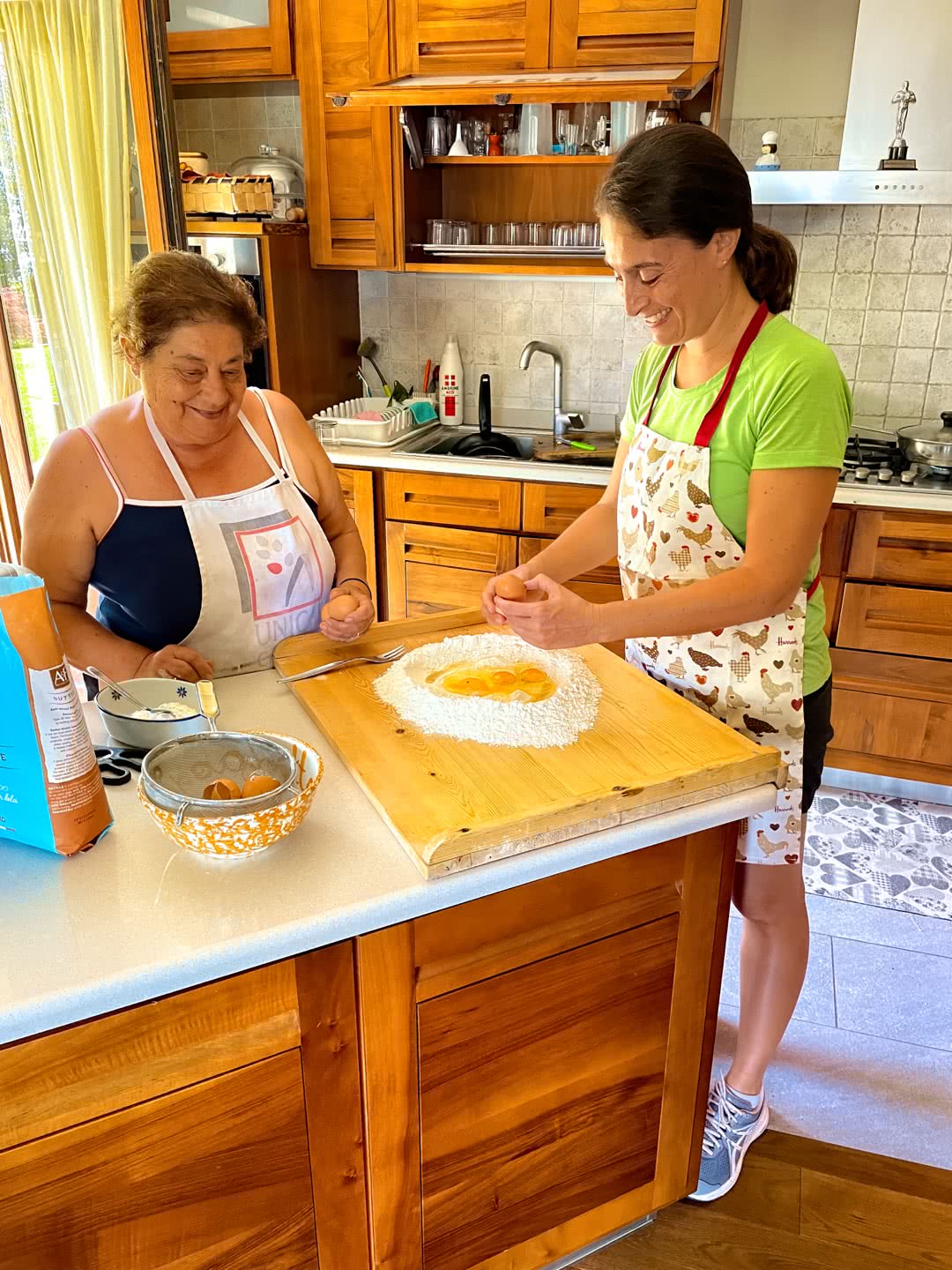 Adding the eggs to the flour volcano