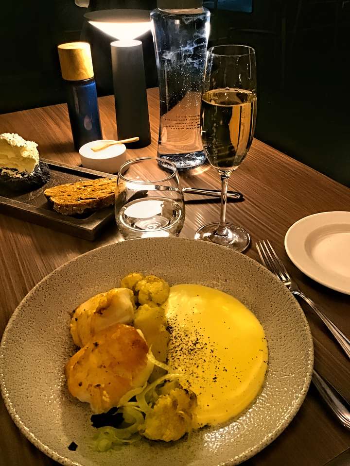 Fish with Hollandaise Sauce, the Delicious Bread and Butter, and the Glass of Prosecco